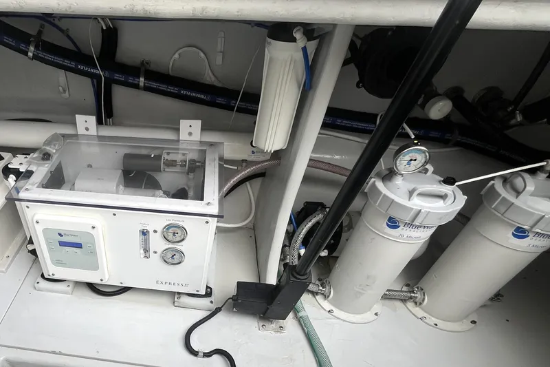 Slide: The Image of Engine room of 2010 Mikelson 43 Sportfisher with water filtration system. - 48