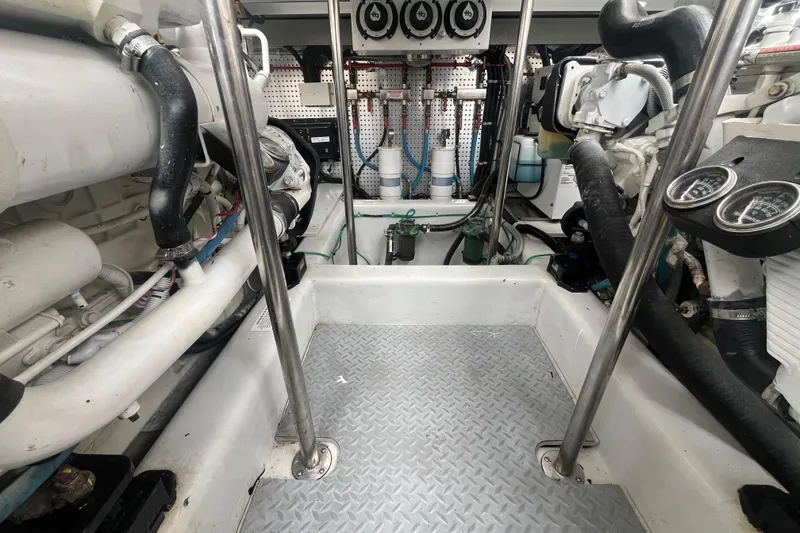Slide: The Image of Engine room of 2010 Mikelson 43 Sportfisher with visible gauges and piping. - 49