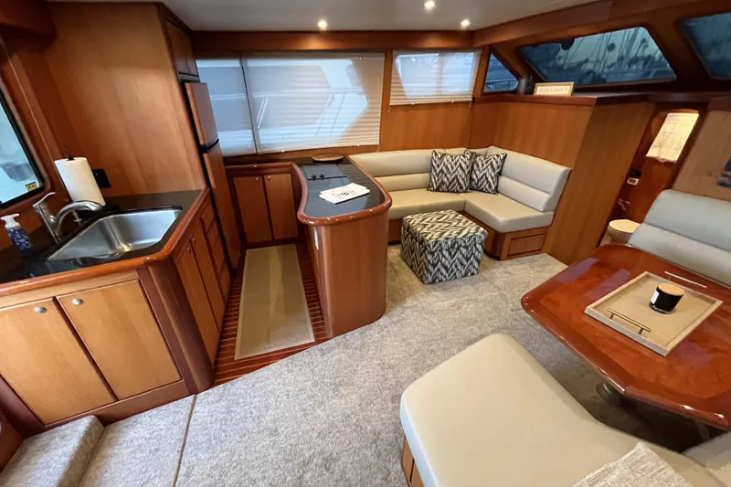 Slide: The Image of Luxurious interior of 2010 Mikelson 43 Sportfisher yacht with kitchen and seating area. - 8