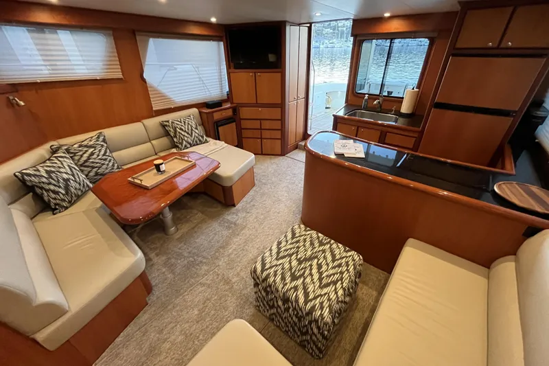 Slide: The Image of Luxurious interior of 2010 Mikelson 43 Sportfisher yacht with elegant seating and modern amenities. - 9