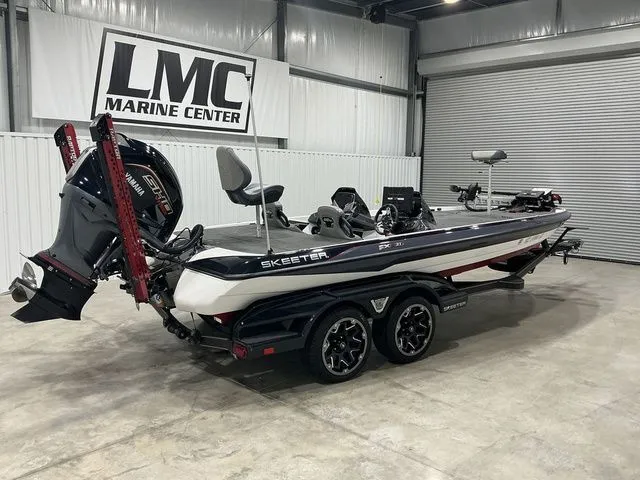 Slide: The Image of 2022 Skeeter FXR21 Apex boat at LMC Marine Center, featuring sleek design and powerful engine. - 13