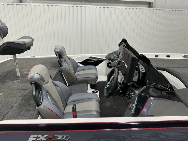 Slide: The Image of 2022 Skeeter FXR21 Apex boat interior with dual seats and advanced dashboard controls. - 14
