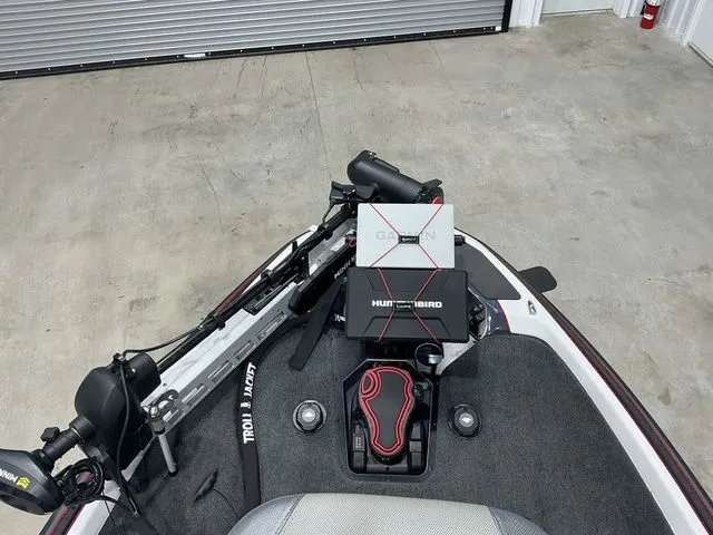 Slide: The Image of 2022 Skeeter FXR21 Apex boat with Garmin and Humminbird electronics on deck. - 17