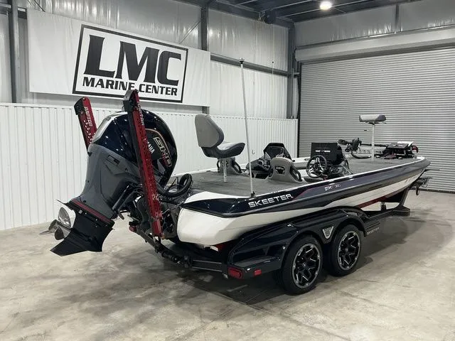 Slide: The Image of 2022 Skeeter FXR21 Apex boat at LMC Marine Center showroom. - 4