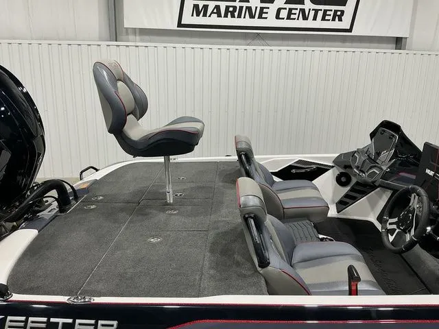 Slide: The Image of 2022 Skeeter FXR21 Apex boat interior with seating and steering console. - 6