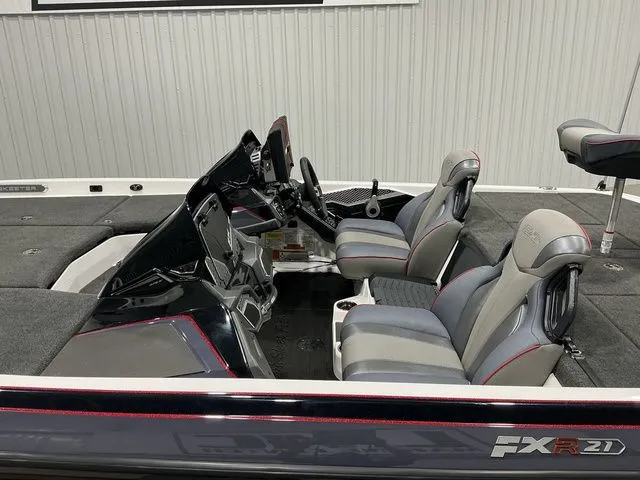 Slide: The Image of 2022 Skeeter FXR21 Apex boat interior with dual seats and modern dashboard. - 8