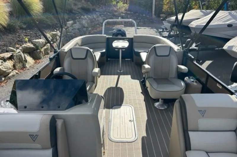 Slide: The Image of 2023 Viaggio L22U pontoon boat with Mercury Pro XS 150 engine, parked outdoors. - 4