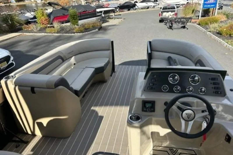 Slide: The Image of 2023 Viaggio L22U pontoon boat with spacious seating and canopy, set against a scenic backdrop. - 5