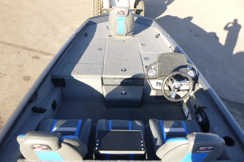 Slide: The Image of 2022 Ranger RT188P boat interior with steering wheel and seating. - 4