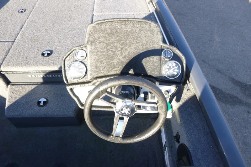 Slide: The Image of 2022 Ranger RT188P boat dashboard with steering wheel and gauges. - 7