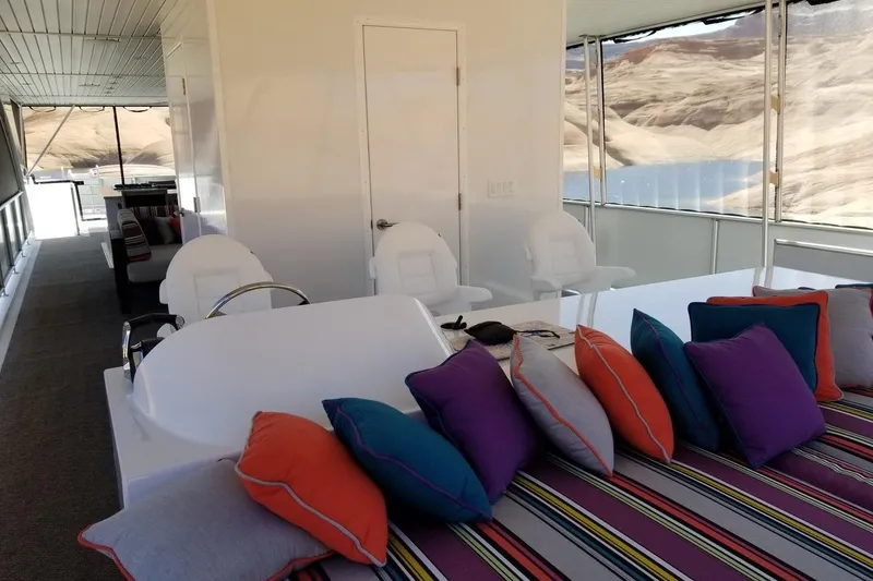 Slide: The Image of Luxurious Adonia 7518 houseboat interior with colorful cushions, spacious seating, and scenic views, 2017 model. - 10