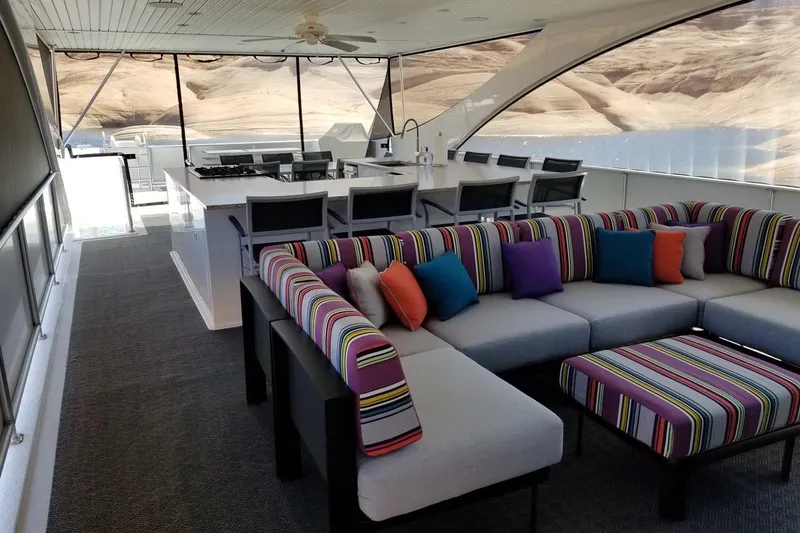 Slide: The Image of Luxurious Adonia 7518 houseboat interior with colorful seating and dining area, 2017 model. - 16