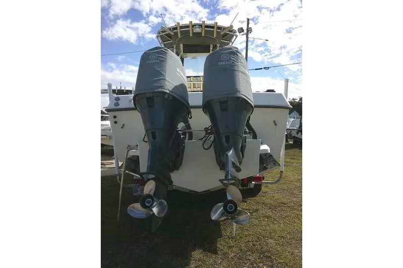 Slide: The Image of 2002 KenCraft Challenger 235 CC with dual Yamaha outboard motors. - 11