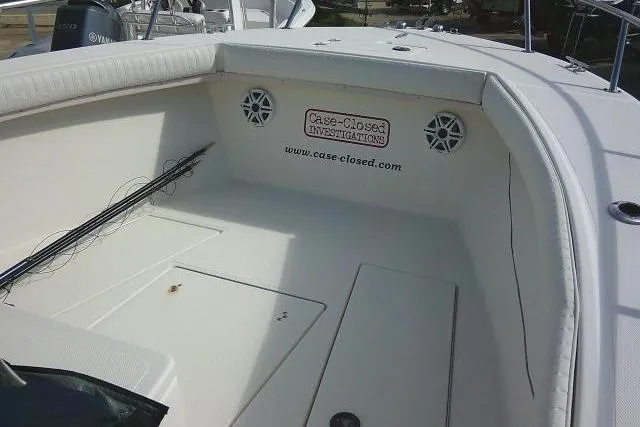 Slide: The Image of 2002 KenCraft Challenger 235 CC boat interior with seating and storage compartments. - 17