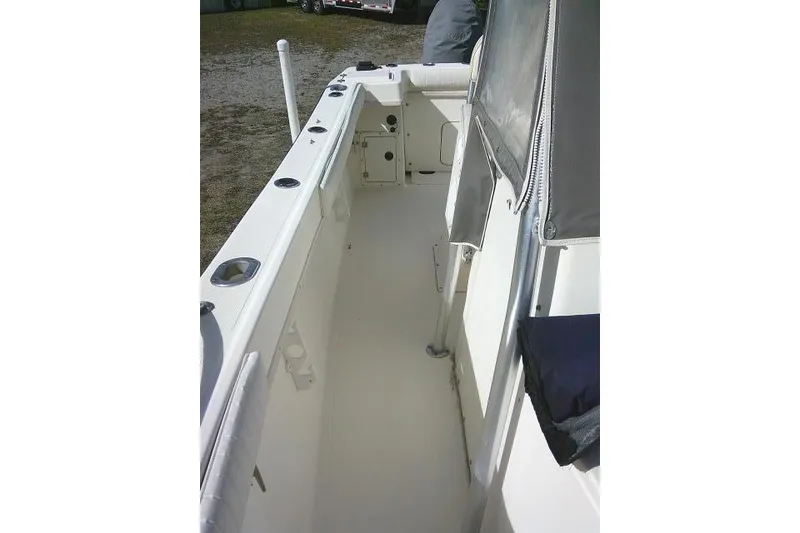 Slide: The Image of 2002 KenCraft Challenger 235 CC boat interior with seating and rod holders. - 24