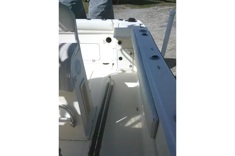 Slide: The Image of 2002 KenCraft Challenger 235 CC boat interior with seating and storage compartments. - 27