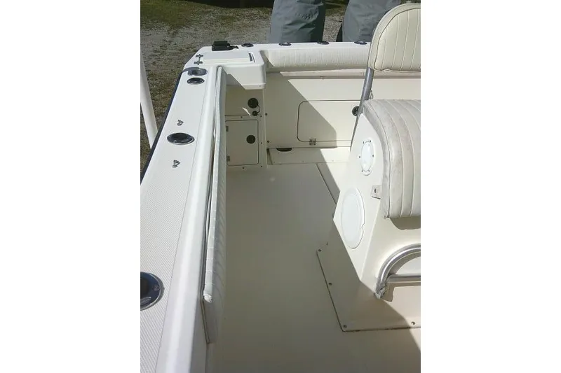 Slide: The Image of 2002 KenCraft Challenger 235 CC boat interior with seating and storage compartments. - 32