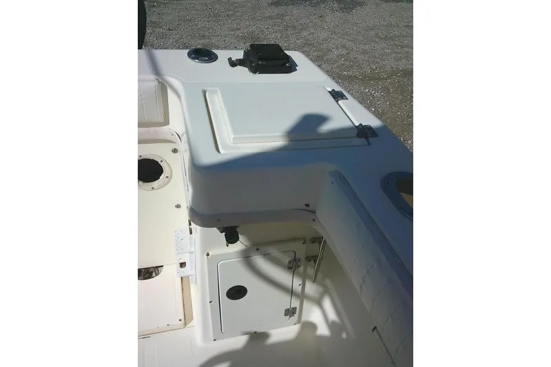 Slide: The Image of 2002 KenCraft Challenger 235 CC boat interior with storage compartments and seating. - 35