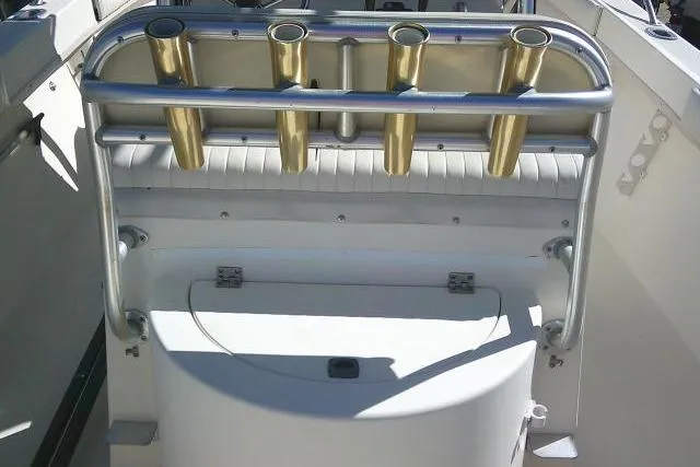 Slide: The Image of 2002 KenCraft Challenger 235 CC boat with rod holders and storage compartment. - 38