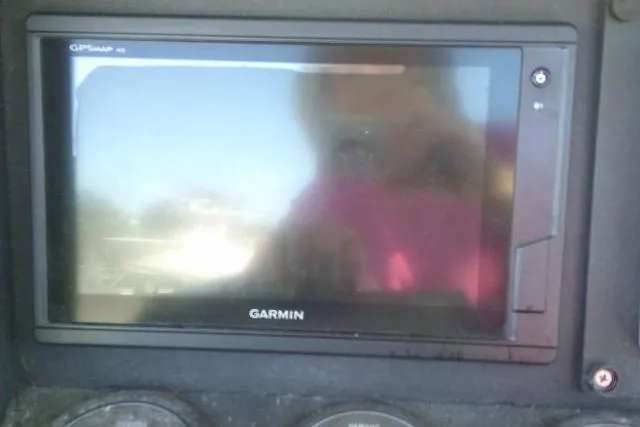 Slide: The Image of Garmin GPS display on 2002 KenCraft Challenger 235 CC boat dashboard. - 41