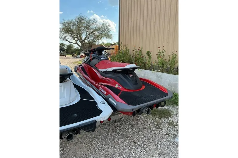 Slide: The Image of 2023 Yamaha WaveRunner VX in red, parked outdoors near a building. - 6