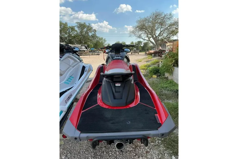 Slide: The Image of 2023 Yamaha WaveRunner VX in red, parked outdoors on gravel. - 8