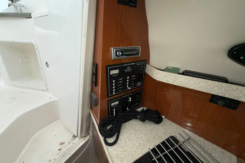 Slide: The Image of 2005 Regal Commodore 265 interior with control panel and coiled rope. - 21
