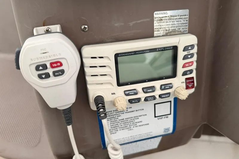 Slide: The Image of VHF radio system on 2005 Regal Commodore 265 boat dashboard. - 28