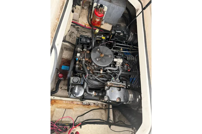 Slide: The Image of Engine compartment of a 2005 Regal Commodore 265 boat, showing detailed mechanical components. - 29