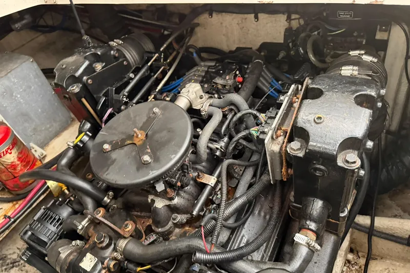 Slide: The Image of Engine compartment of a 2005 Regal Commodore 265 boat, showcasing mechanical components. - 30