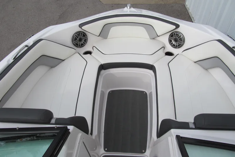Slide: The Image of 2016 Yamaha Boats AR192 interior with white seating and speakers. - 10