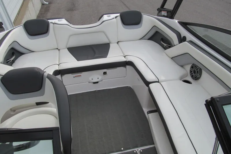 Slide: The Image of 2016 Yamaha Boats AR192 interior with white and black seating, spacious layout. - 14