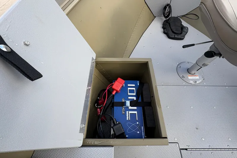 Slide: The Image of 2022 Lund 1800 Alaskan Tiller boat battery compartment with Ionic deep cycle battery. - 11