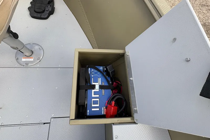 Slide: The Image of 2022 Lund 1800 Alaskan Tiller boat battery compartment with IONIC deep cycle batteries. - 12
