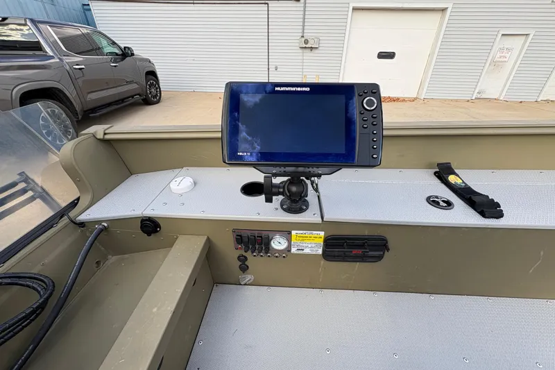 Slide: The Image of 2022 Lund 1800 Alaskan Tiller boat interior with Humminbird Helix 10 fish finder. - 18