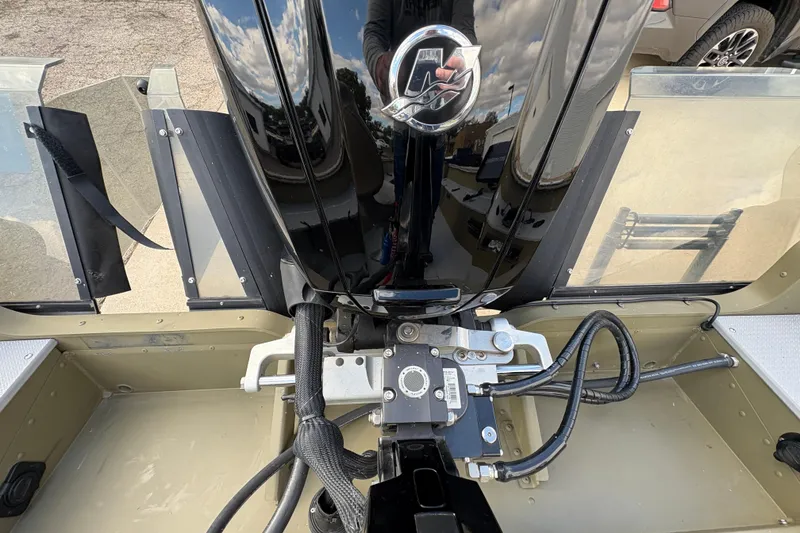 Slide: The Image of 2022 Lund 1800 Alaskan Tiller boat interior with motor and controls. - 22