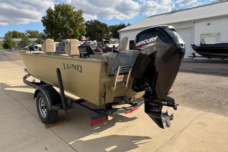 Slide: The Image of 2022 Lund 1800 Alaskan Tiller boat with Mercury outboard motor on trailer. - 3