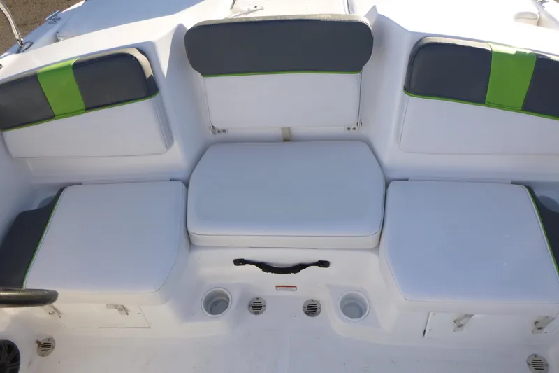 Slide: The Image of 2024 Tahoe T16 boat seating with white and green cushions. - 11