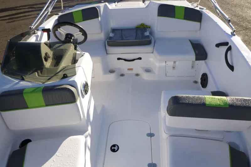 Slide: The Image of 2024 Tahoe T16 boat interior with modern seating and steering wheel. - 6