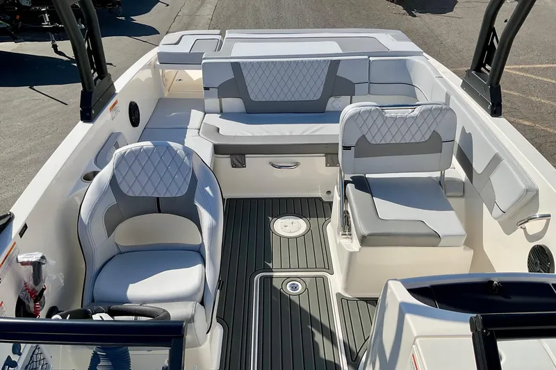 Slide: The Image of 2026 Bayliner VR6 Bowrider I/O interior with modern seating and sleek design. - 11