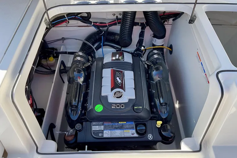 Slide: The Image of Engine compartment of 2026 Bayliner VR6 Bowrider I/O, showcasing powerful inboard motor. - 16