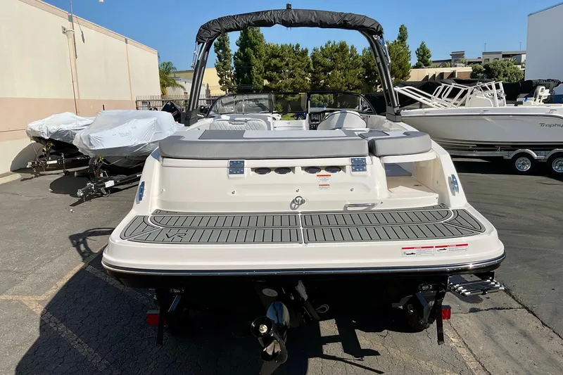 Slide: The Image of 2026 Bayliner VR6 Bowrider I/O boat, rear view, parked outdoors. - 4