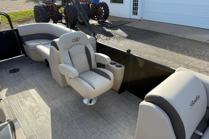 Slide: The Image of 2026 Bentley Pontoons Legacy 223 Navigator interior with luxurious seating and modern design. - 14