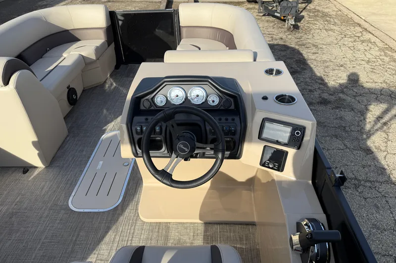Slide: The Image of 2026 Bentley Pontoons Legacy 223 Navigator interior with steering console and seating. - 15