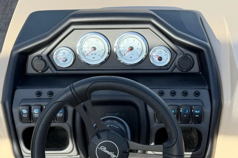 Slide: The Image of Dashboard of 2026 Bentley Pontoons Legacy 223 Navigator with steering wheel and gauges. - 17