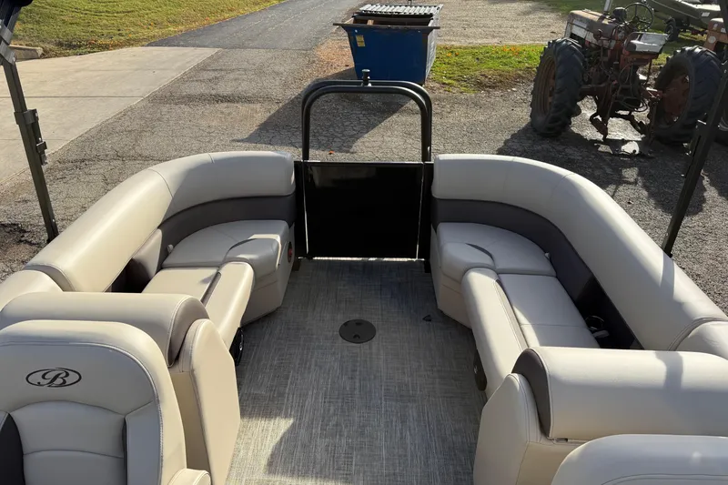 Slide: The Image of 2026 Bentley Pontoons Legacy 223 Navigator interior with plush seating and modern design. - 18