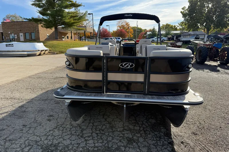 Slide: The Image of 2026 Bentley Pontoons Legacy 223 Navigator, black and beige, parked outdoors. - 2