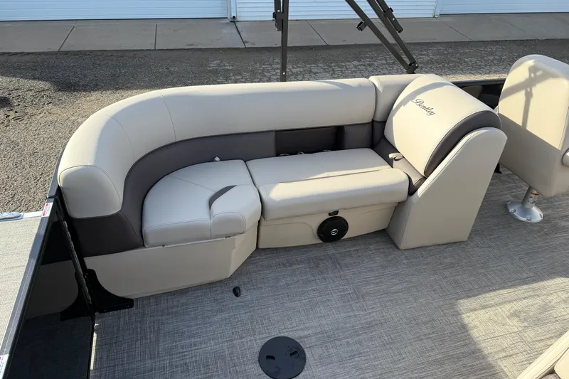 Slide: The Image of 2026 Bentley Pontoons Legacy 223 Navigator interior seating with beige upholstery. - 20