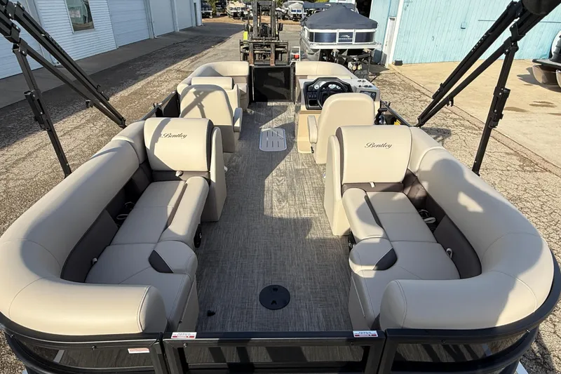Slide: The Image of 2026 Bentley Pontoons Legacy 223 Navigator interior with beige seating and modern design. - 23