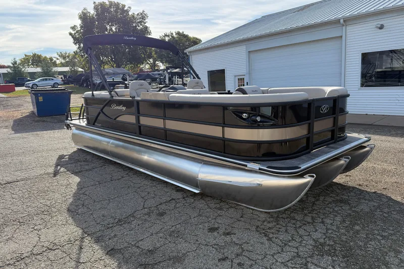 Slide: The Image of 2026 Bentley Pontoons Legacy 223 Navigator pontoon boat parked outdoors. - 3